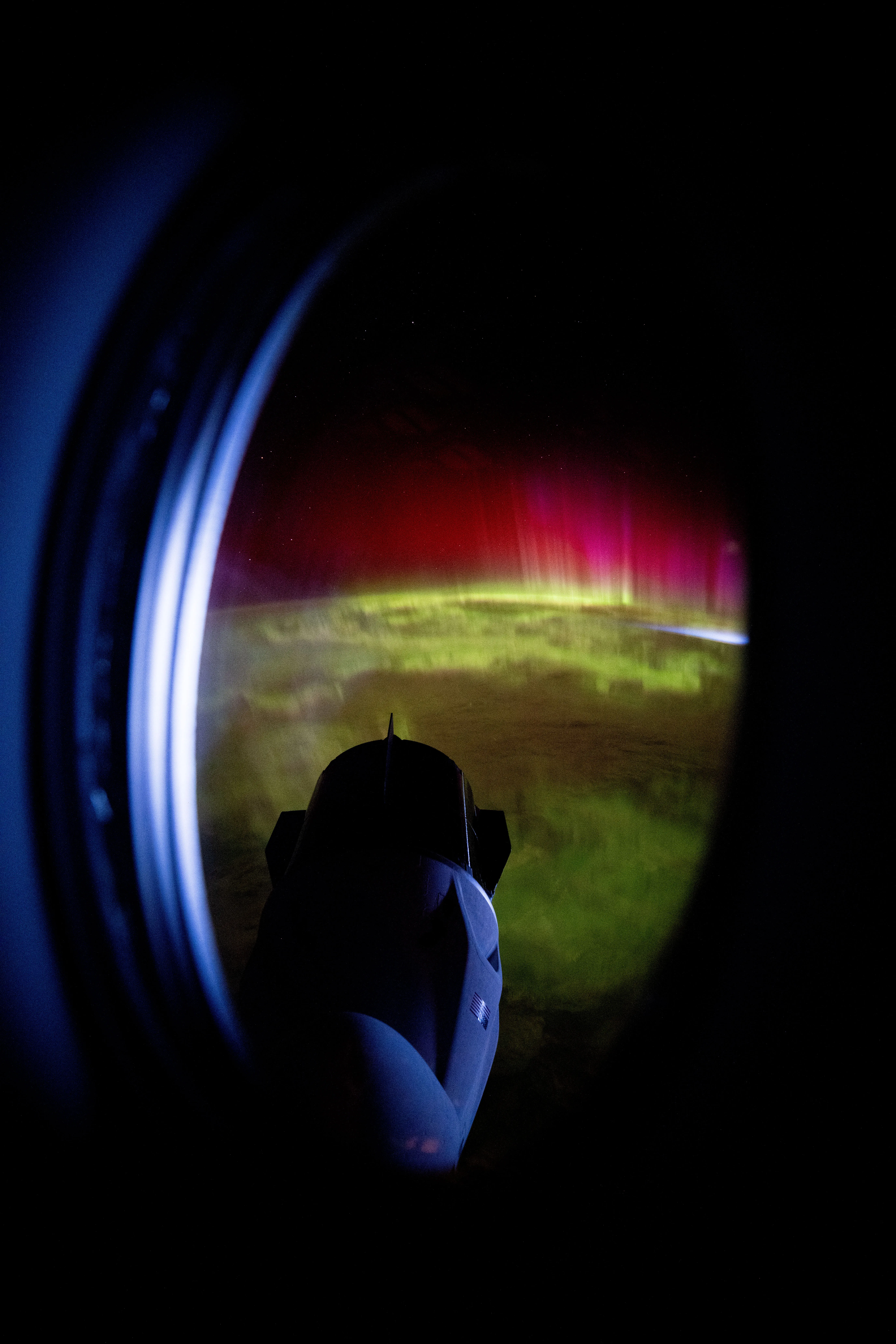 Red and Green Aurora Move Through Earth’s Atmosphere 